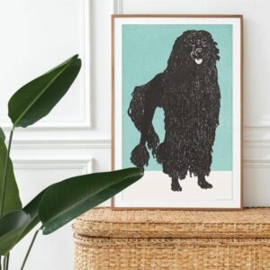 Framed artwork of fluffy black dog near plant