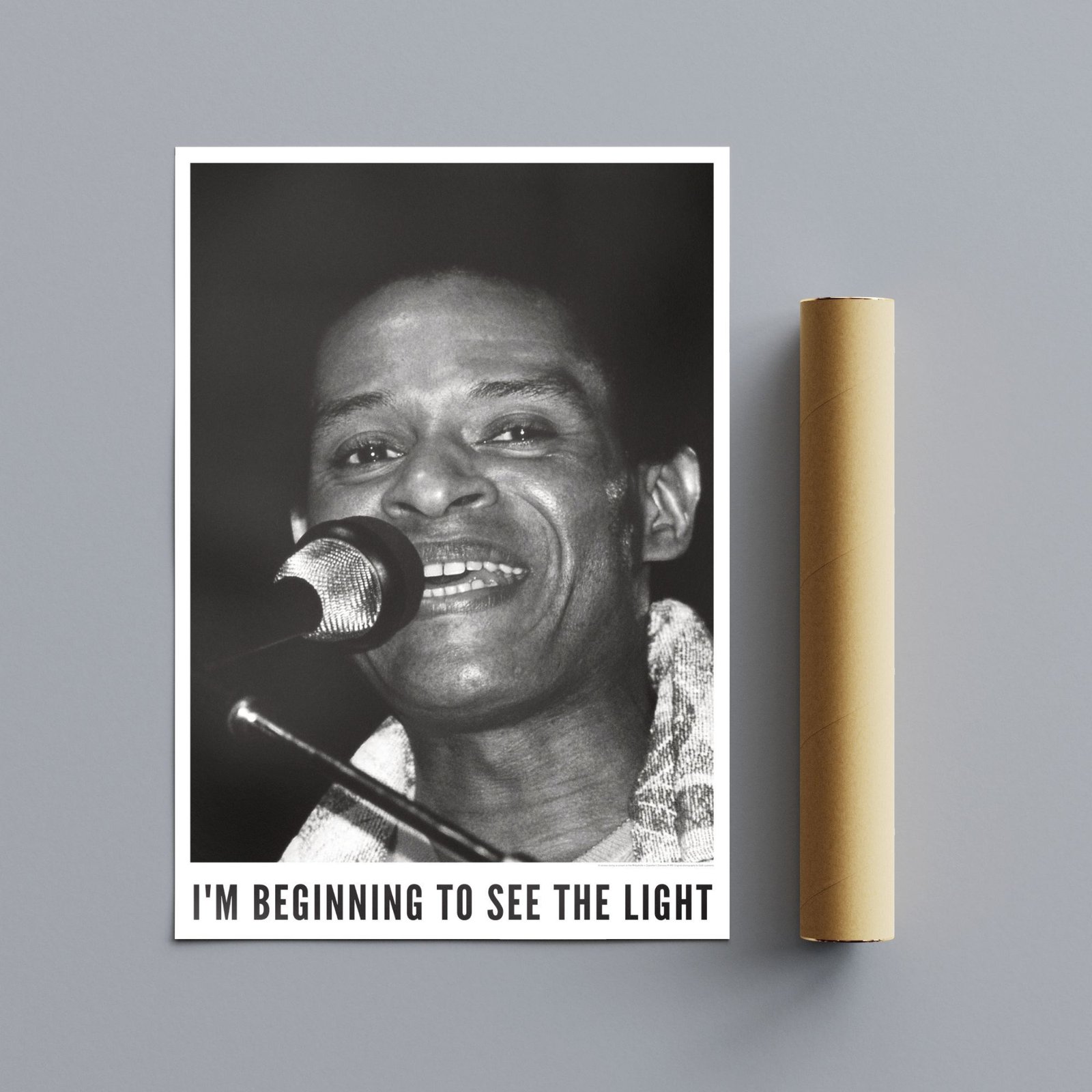 Black and white singer portrait beside paper roll