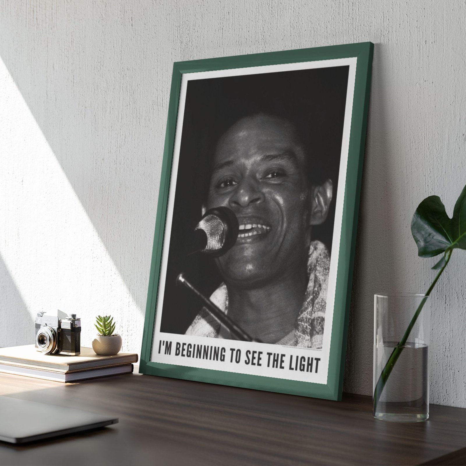 Framed photo of singer with motivational quote.