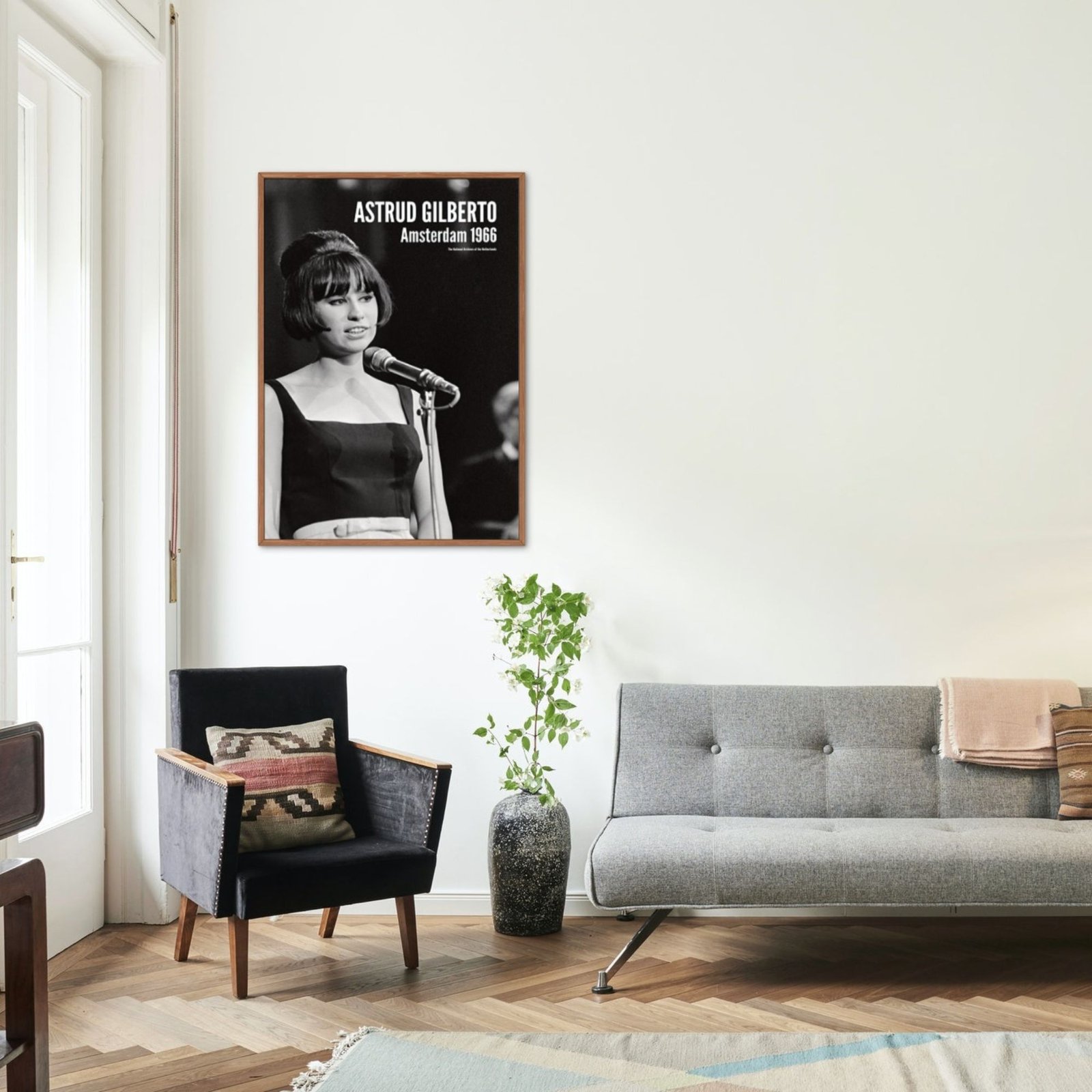 Stylish living room with framed singer photo on wall.