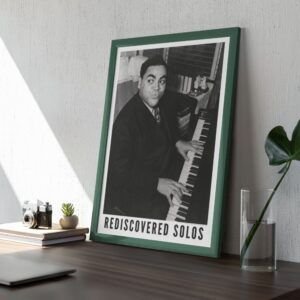 Framed photo of pianist with 'Rediscovered Solos' text.