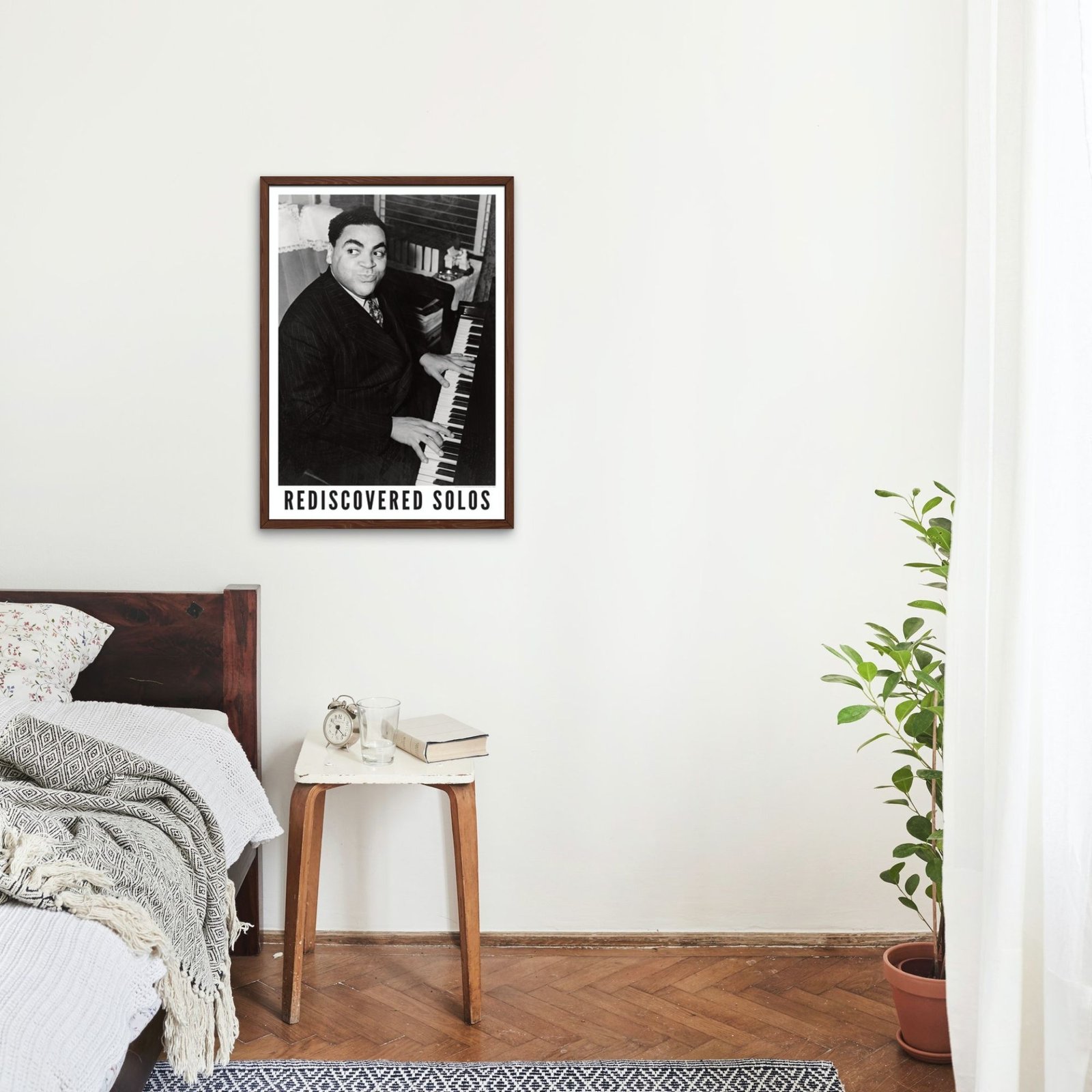 Bedroom with poster of pianist and plant decor.