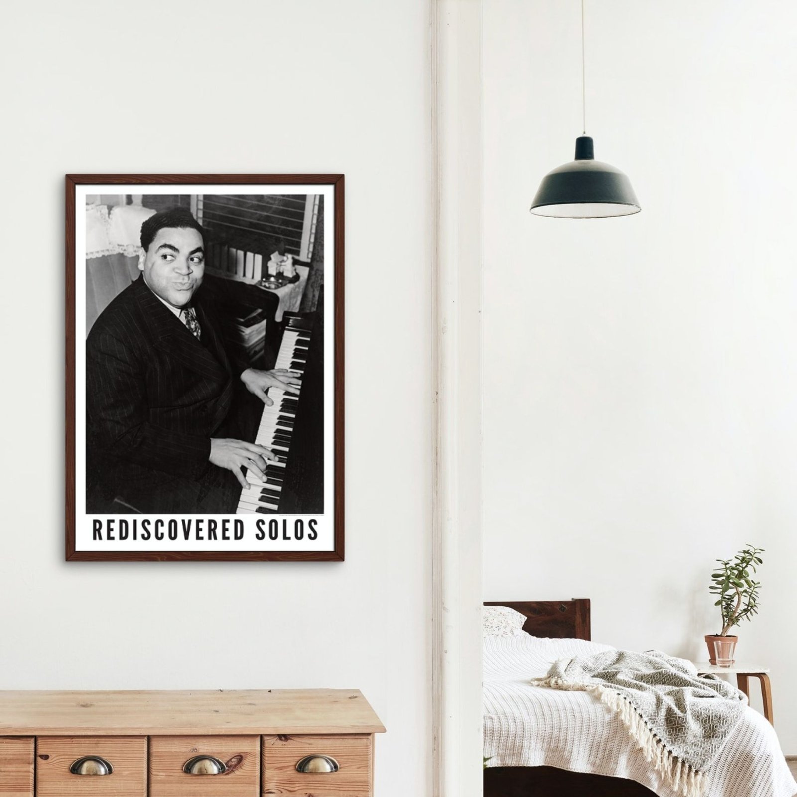 Piano player in framed photo on bedroom wall.