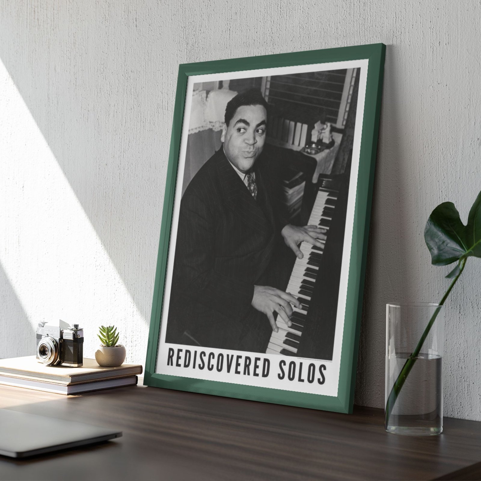 Framed photo of pianist with 'Rediscovered Solos' text.