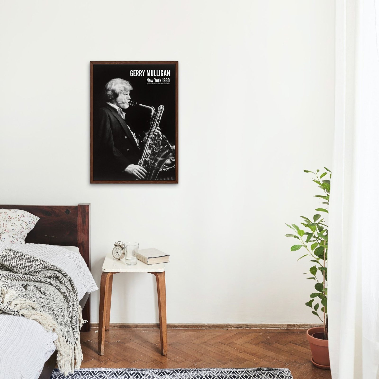 Bedroom with saxophone poster on wall.