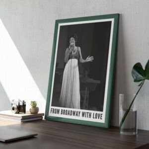 Framed photo of singer on desk, Broadway theme.
