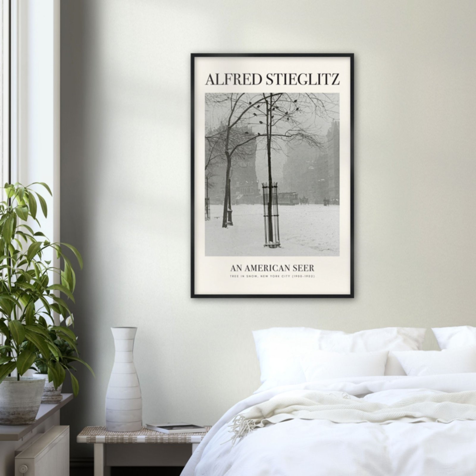Framed art print in minimalist bedroom decor.