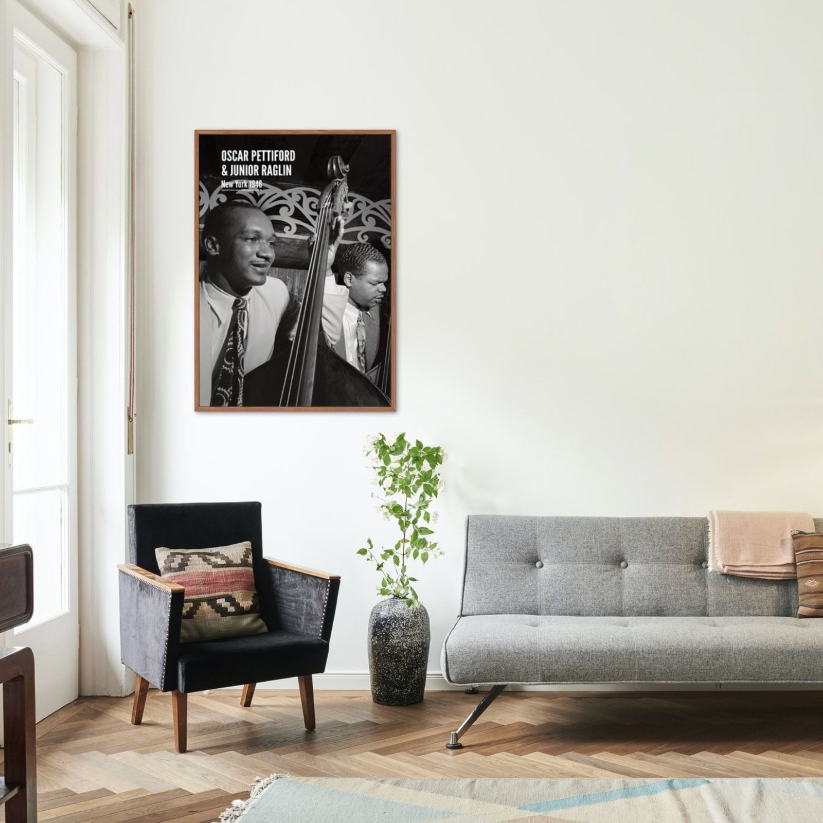 Modern living room with jazz musician poster.