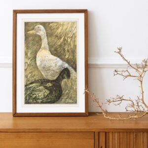 Framed duck painting on wooden cabinet with branches.