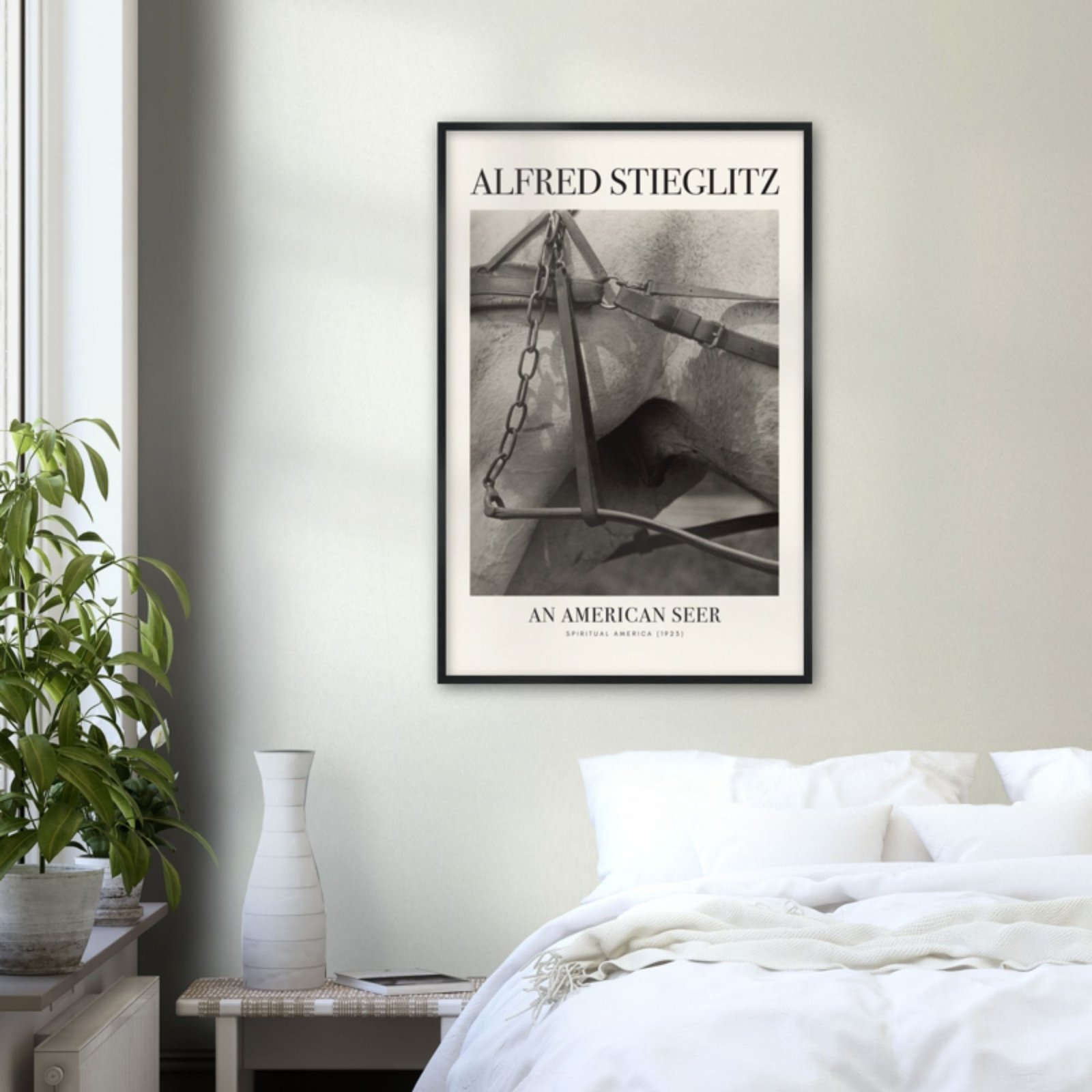 Bedroom with Alfred Stieglitz art poster on wall.