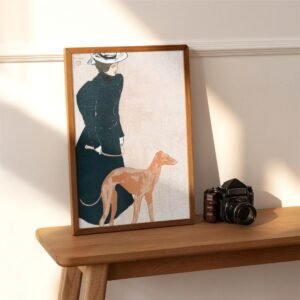 Framed vintage dog artwork with camera on wooden table.