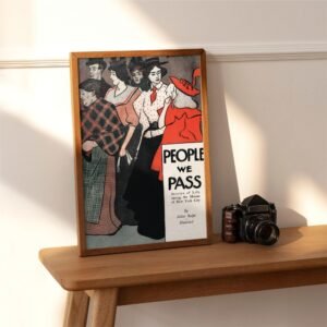 Framed vintage poster with camera on wooden table.