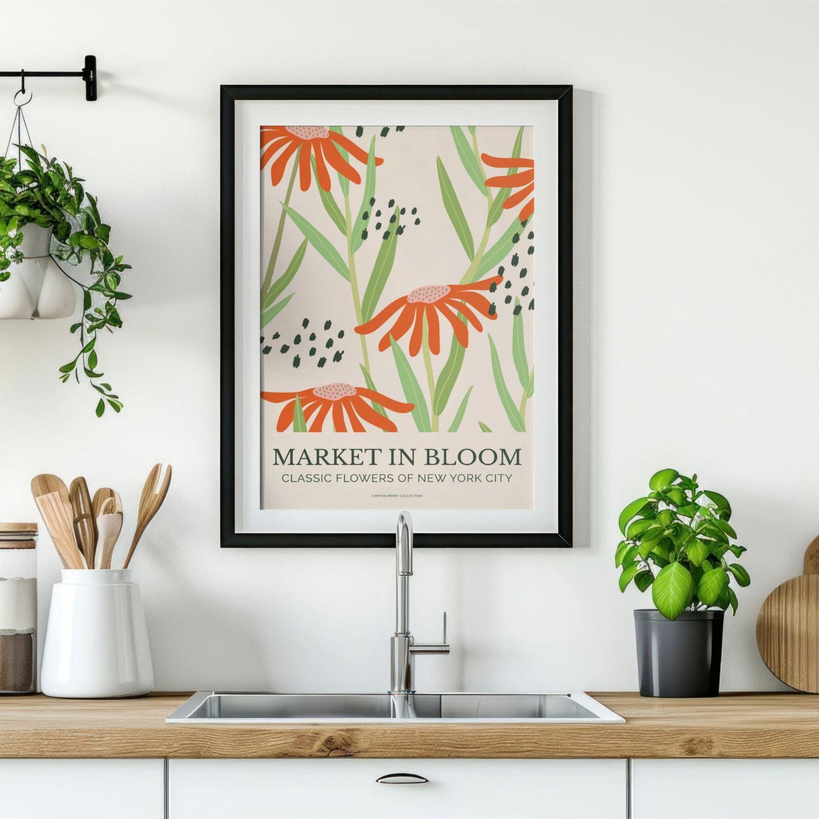 Kitchen with framed floral artwork above sink.
