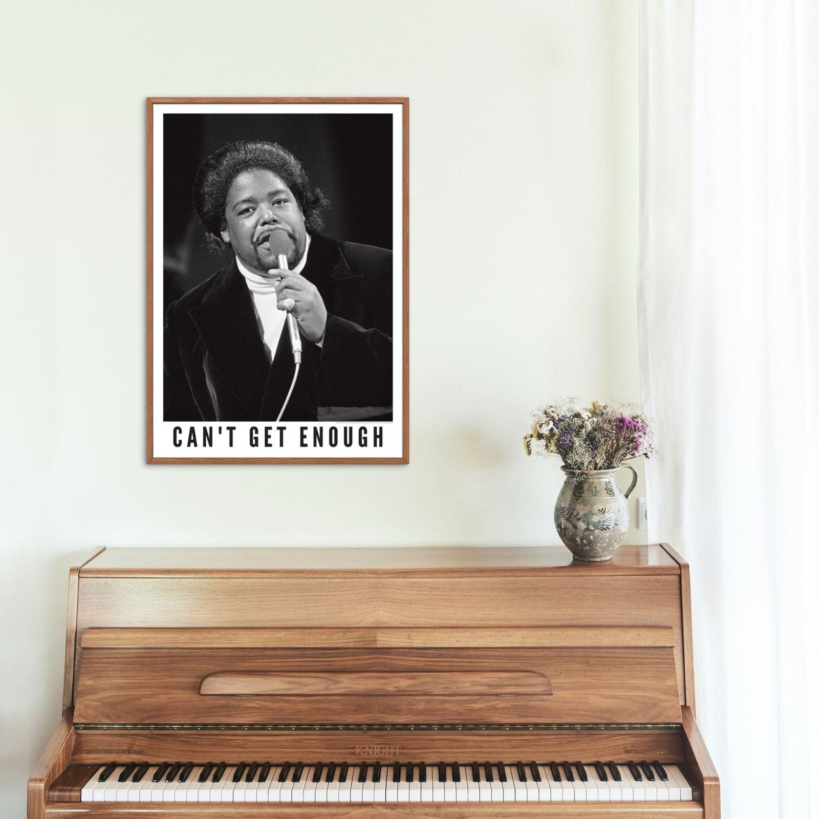 Poster above wooden piano with vintage decor.