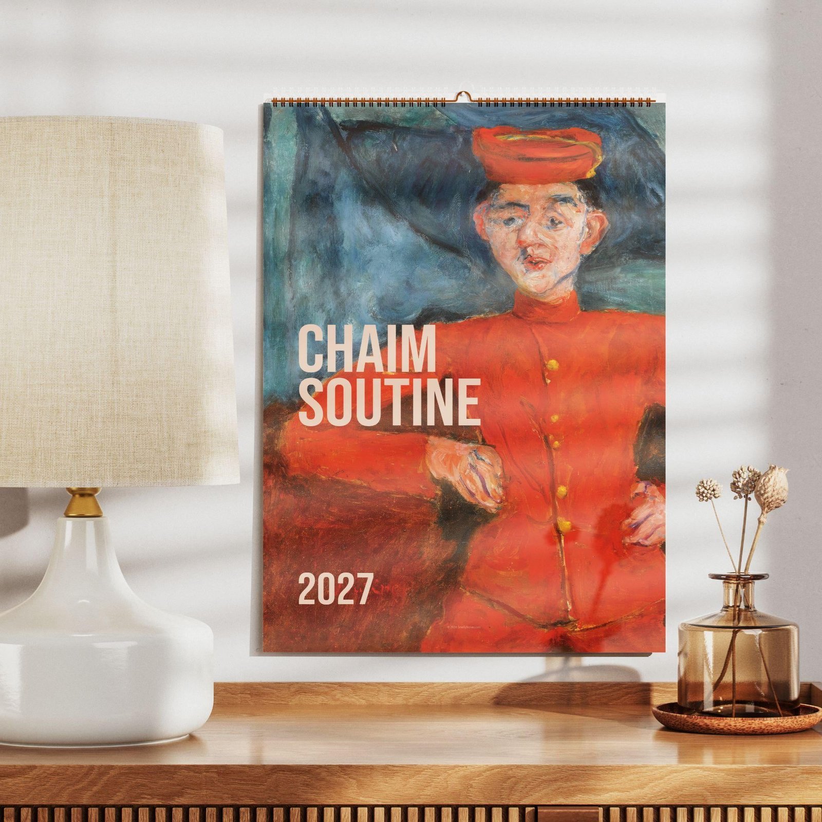 Chaim Soutine 2027 calendar on shelf with lamp.