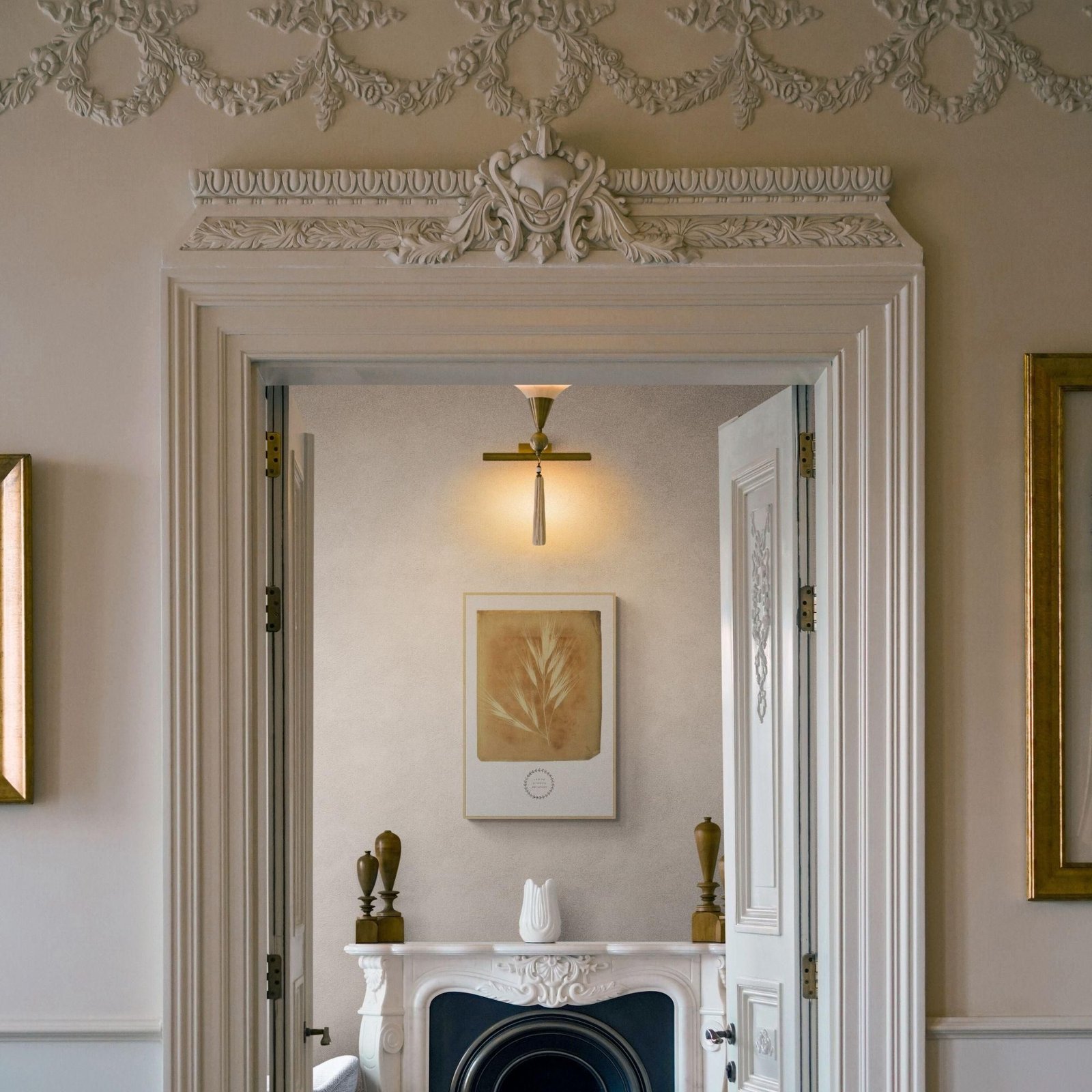 Elegant interior doorway with decorative molding.