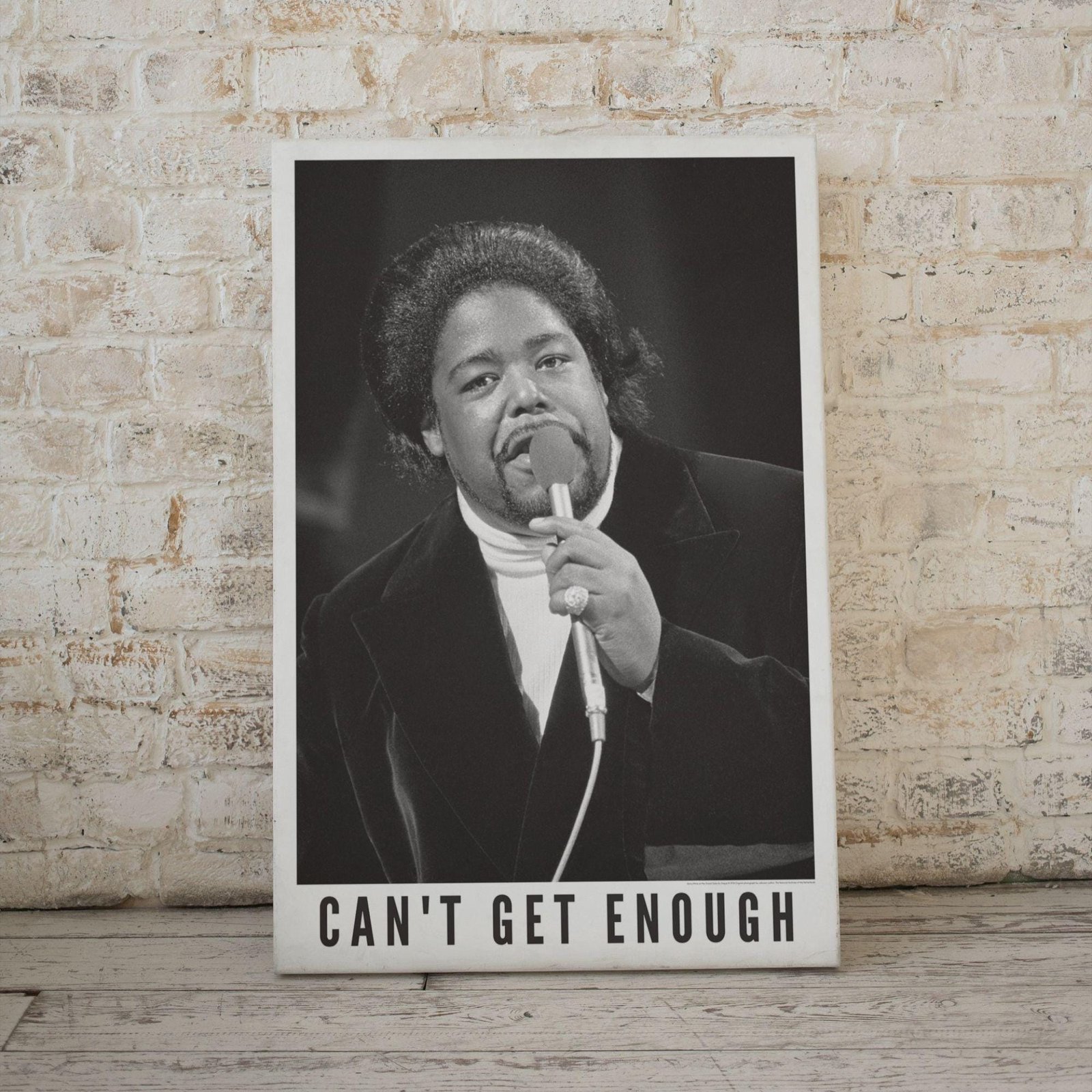 Vintage singer poster with 'Can't Get Enough' text.