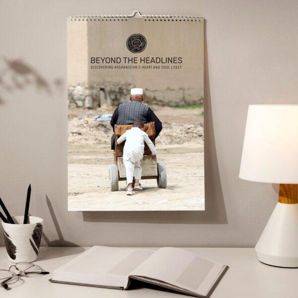 2027 wall calendar Beyond the Headlines Afghanistan on desk