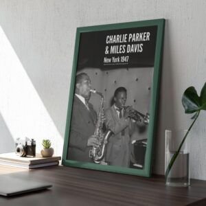 Framed photo of jazz musicians on a desk.