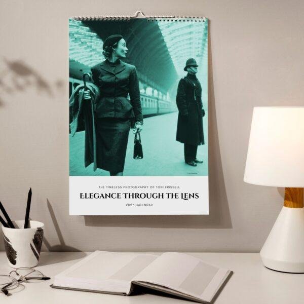 2027 Toni Frissell photography wall calendar on desk