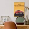 2027 Oldsmobile classic car wall calendar hanging above desk