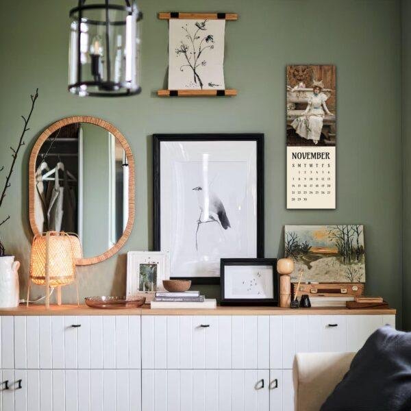 Cozy green room with gallery wall and white sideboard