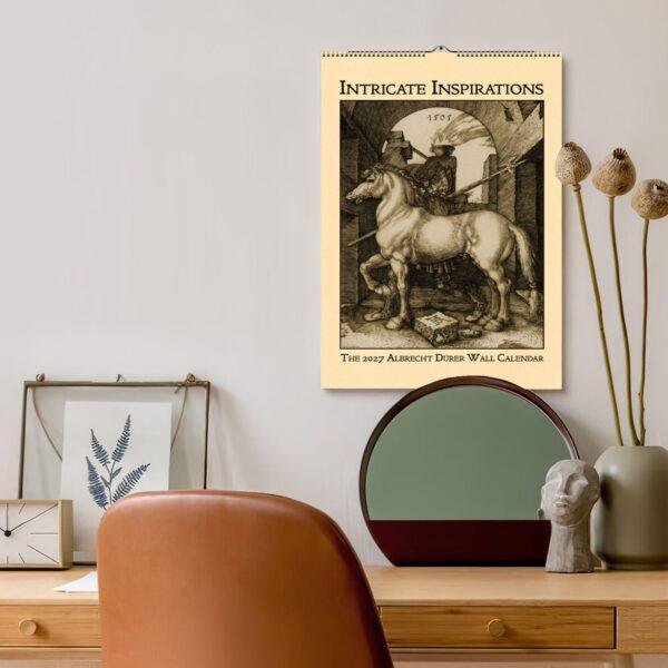 2027 Albrecht Dürer wall calendar hanging above stylish desk
