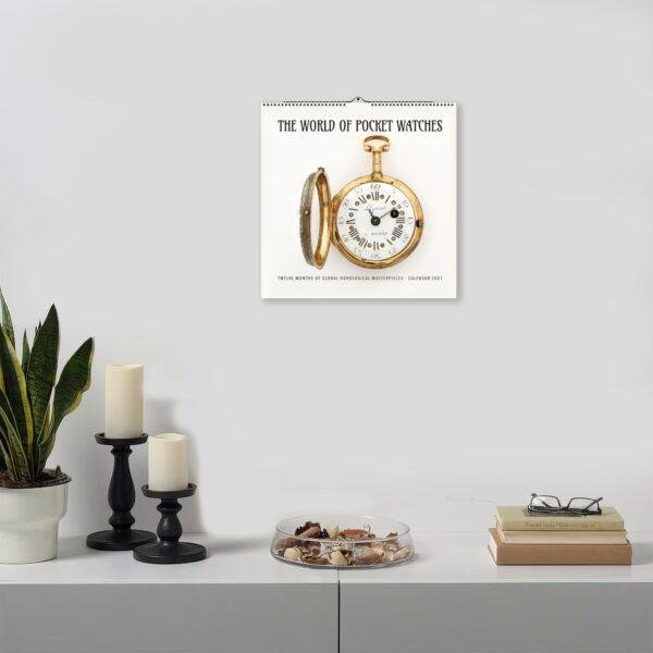 World of Pocket Watches 2027 calendar hanging on wall