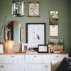 Stylish green living room with gallery wall and white sideboard