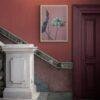 Floral art print on terracotta wall above marble staircase