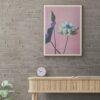 Framed lotus flower art print on brick wall above console