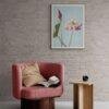 Cozy reading nook with pink armchair and lotus flower art