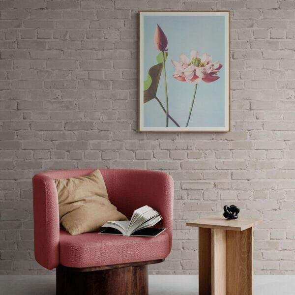 Cozy reading nook with pink armchair and lotus flower art