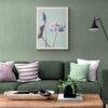 Modern green living room with floral wall art above sofa
