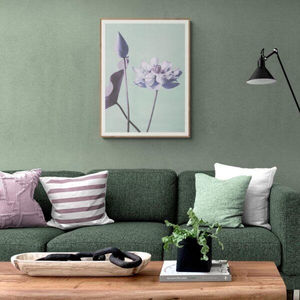 Modern green living room with floral wall art above sofa
