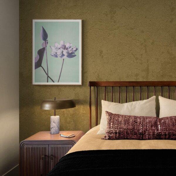 Elegant bedroom with floral art print above nightstand