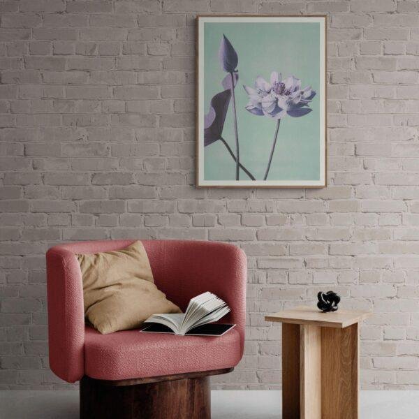 Cozy reading nook with pink armchair and floral wall art