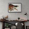 Vintage fish illustration framed above rustic wooden desk