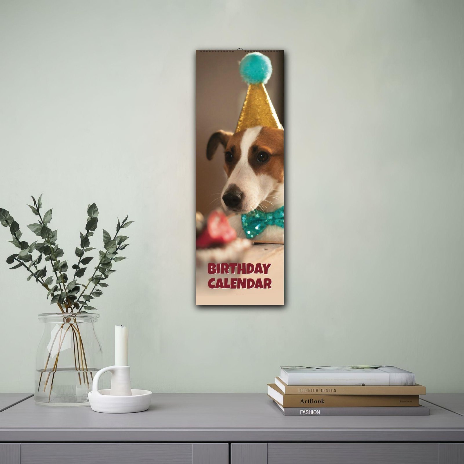 Dog birthday calendar hanging on wall above desk