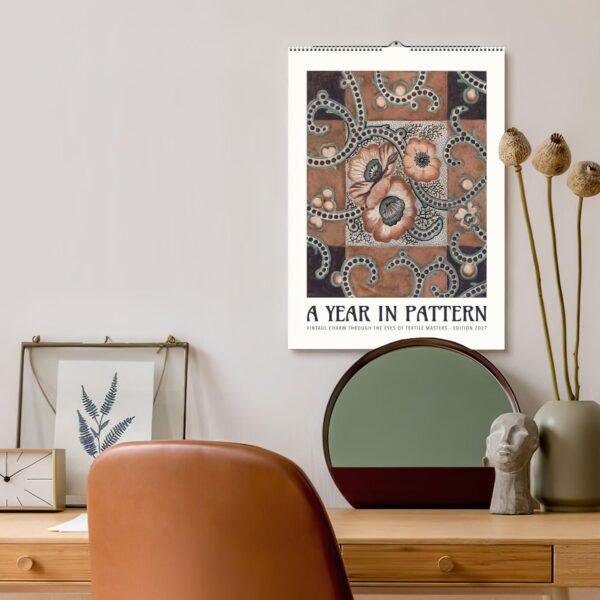 Vintage floral pattern wall calendar above stylish home desk