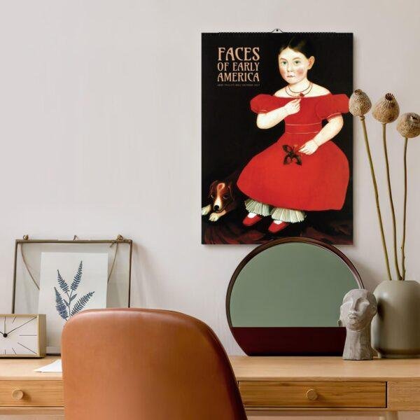 Faces of Early America calendar hanging above a stylish desk