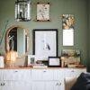 Stylish green room with gallery wall and white sideboard