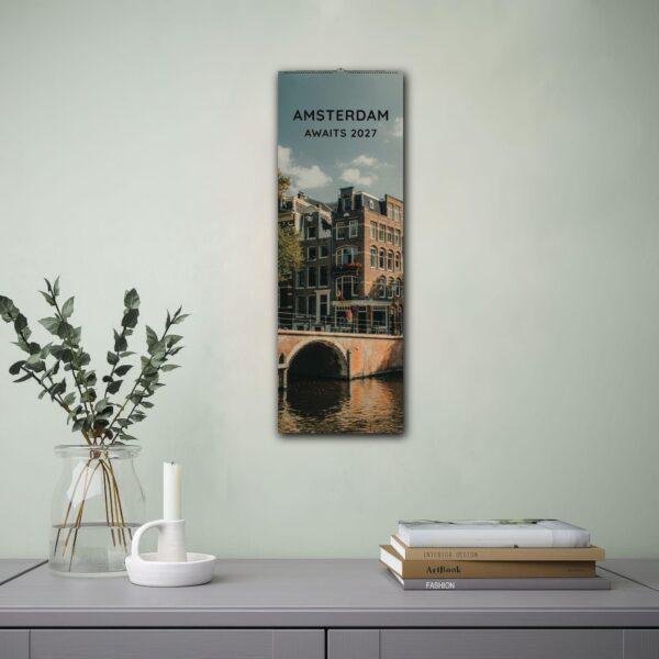 Amsterdam Awaits 2027 wall calendar hung in modern room