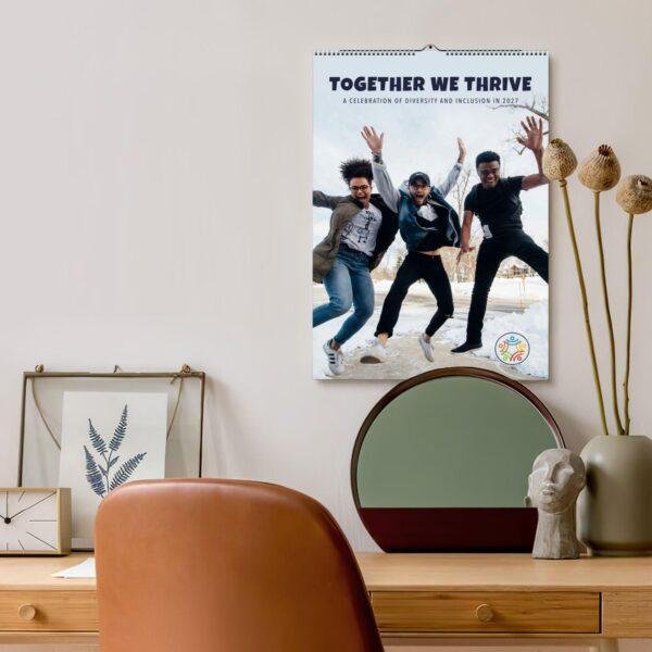 Together We Thrive 2027 diversity calendar hanging on wall