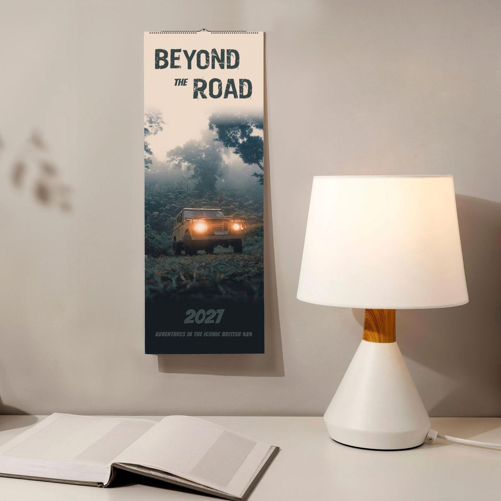 2027 Beyond the Road Land Rover wall calendar on desk
