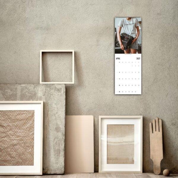 April 2027 wall calendar hanging in minimalist studio space