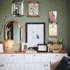 Stylish green room with gallery wall and white sideboard