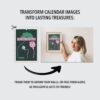Woman framing Visual Voyage calendar art on wall