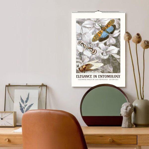 Elegance in Entomology 2027 wall calendar above stylish desk