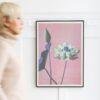 Framed lotus flower art print on white wall